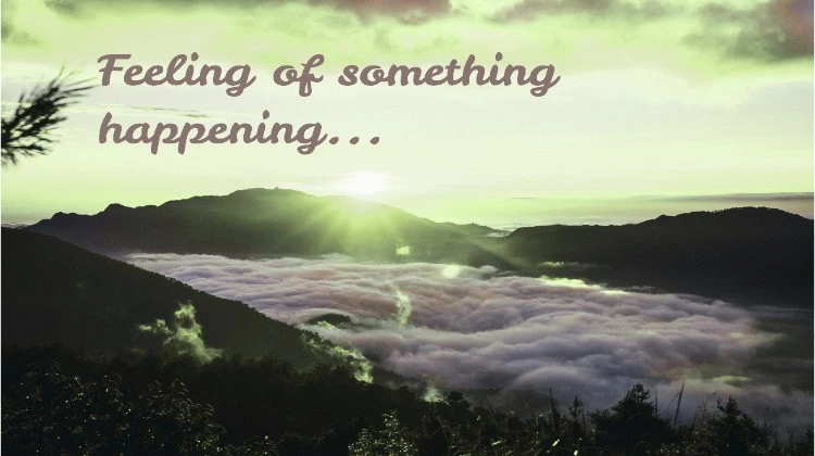 A beautiful natural scene, with mountains, sky, and clouds. "feeling of something happening" is written.