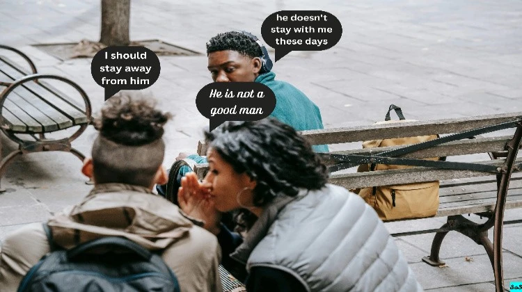 A girl is speaking to a boy. The boy's friend looks back at them. Both friends are thinking something in their hearts.