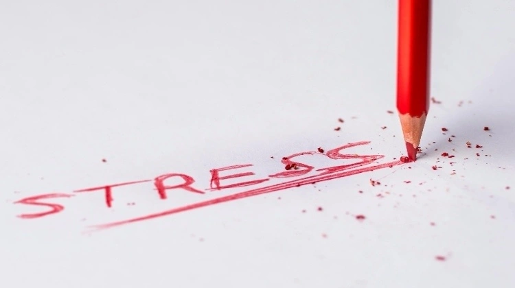 "stress" written on a white paper